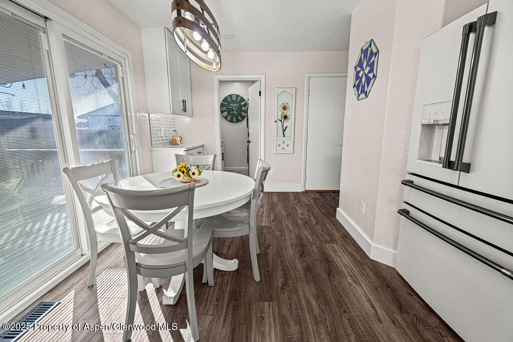 193 Barker Street Craig, CO 81625 - Photo 11 of 50 a view of a dining room with furniture and wooden floor