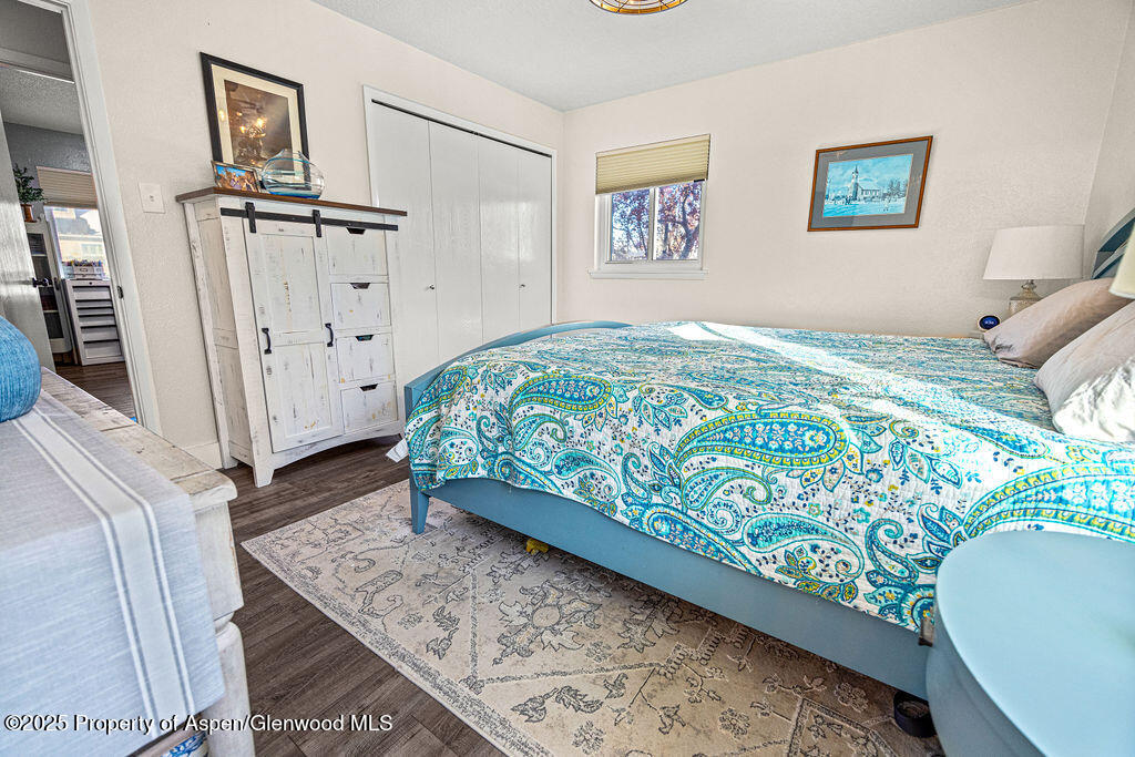 193 Barker Street Craig, CO 81625 - Photo 16 of 50 a bedroom with a bed and cabinets