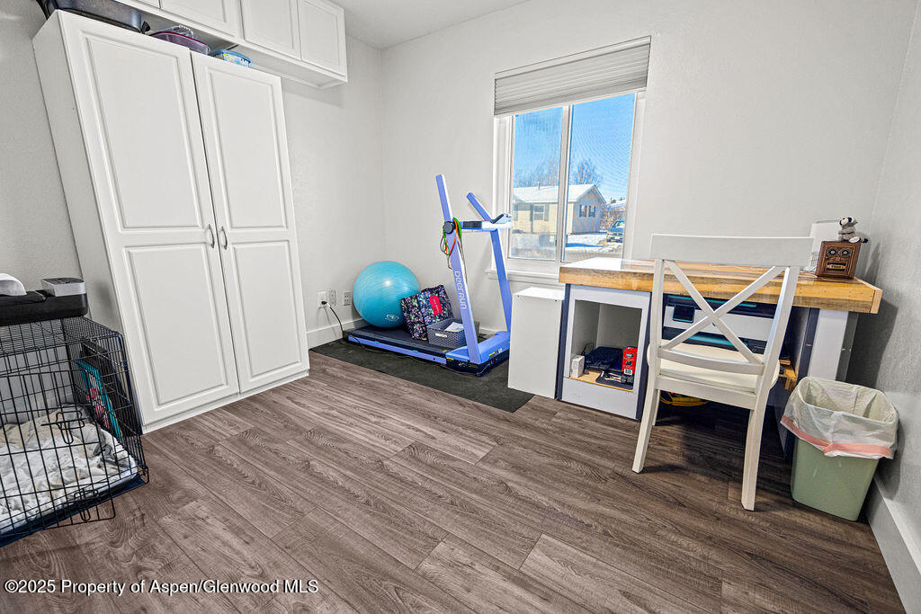 193 Barker Street Craig, CO 81625 - Photo 19 of 50 a view of a workspace with furniture and wooden floor