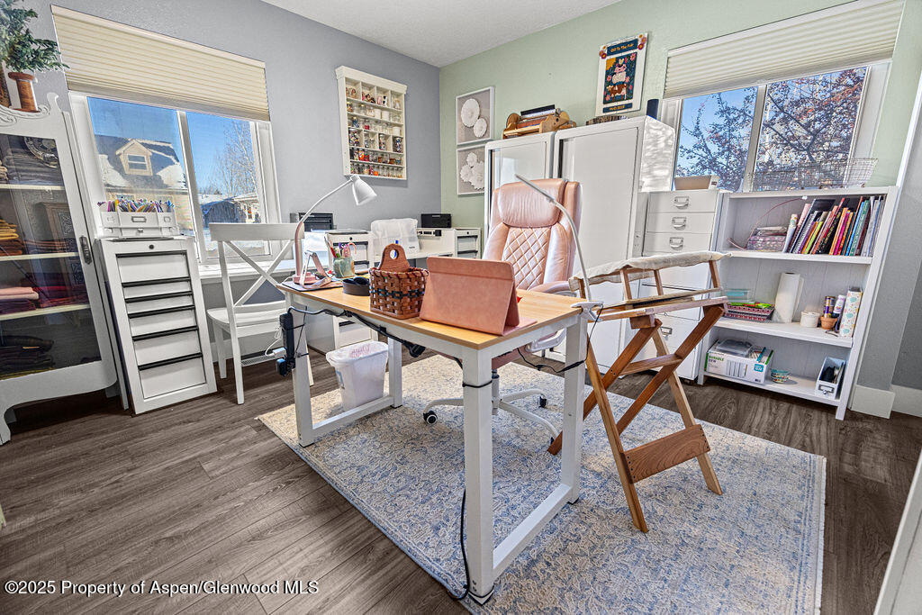 193 Barker Street Craig, CO 81625 - Photo 25 of 50 a room with furniture a rug and a book shelf