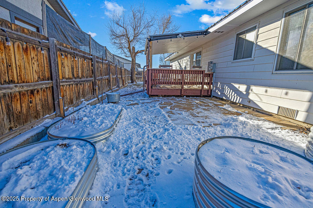 193 Barker Street Craig, CO 81625 - Photo 33 of 50 a view of a backyard with wooden floor and iron stairs