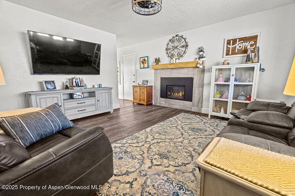 193 Barker Street Craig, CO 81625 - Photo 4 of 50 a living room with furniture and a flat screen tv