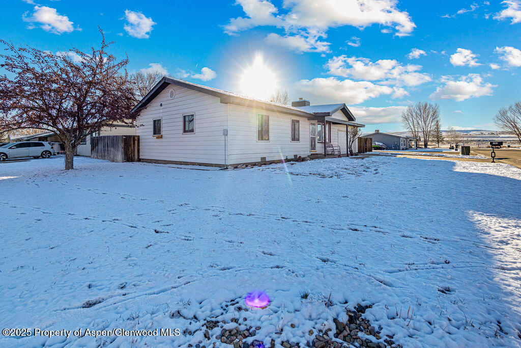 193 Barker Street Craig, CO 81625 - Photo 43 of 50 a view of a house with a yard