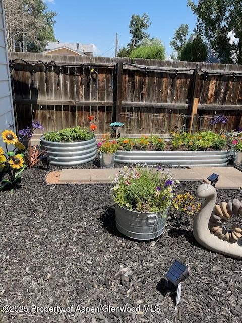 193 Barker Street Craig, CO 81625 - Photo 48 of 50 a garden view with a seating space