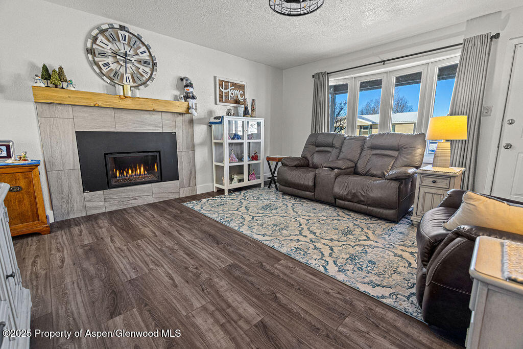 193 Barker Street Craig, CO 81625 - Photo 5 of 50 a living room with furniture and a fireplace
