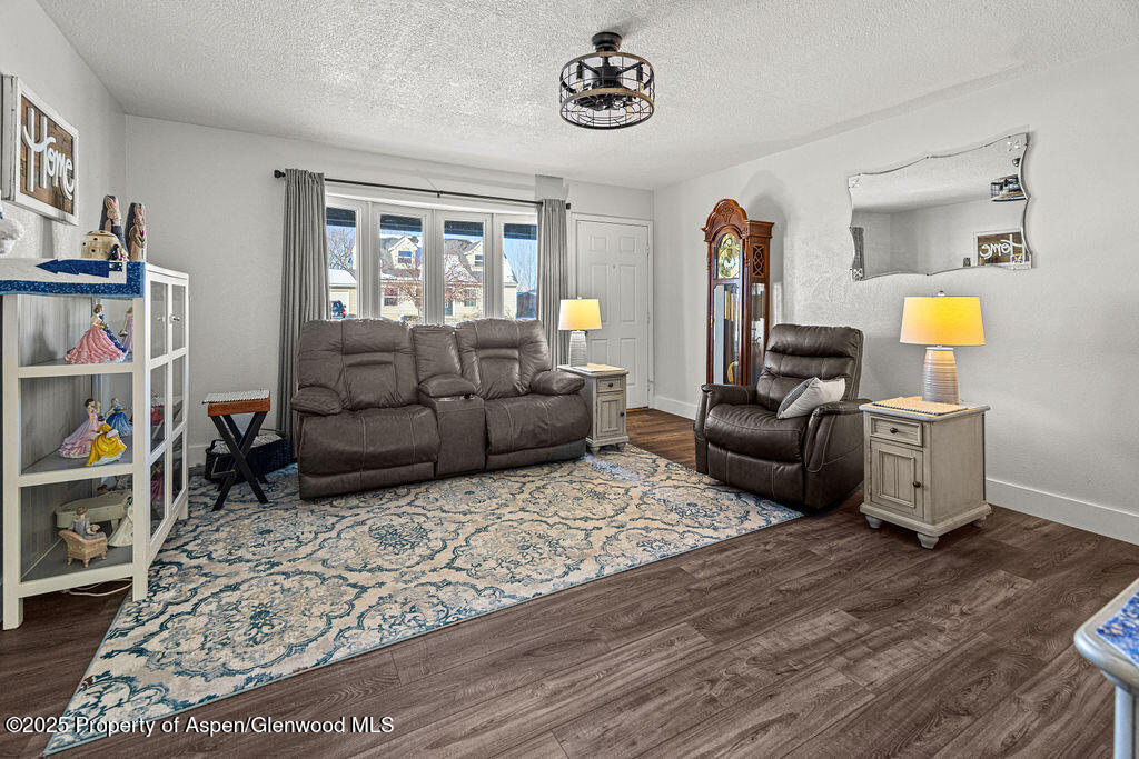193 Barker Street Craig, CO 81625 - Photo 6 of 50 a living room with furniture and a window