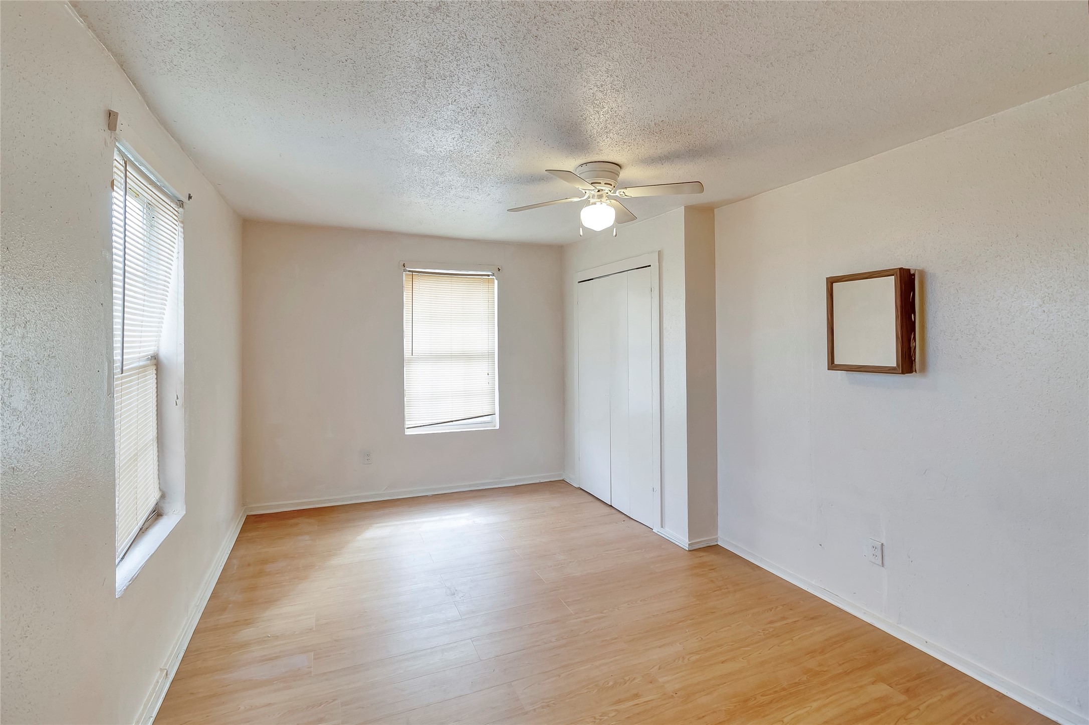 4233 Du Pont Street, Unit A Houston, TX 77021 - Photo 7 of 11 This bedroom features custom paint, ceiling fan with lighting and large windows.