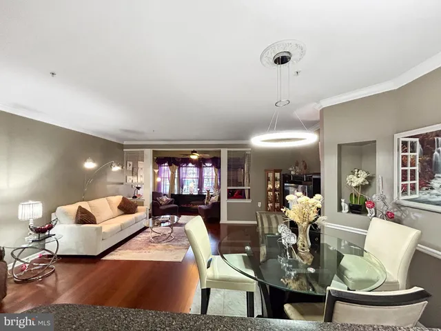 a living room with fireplace furniture and a wooden floor