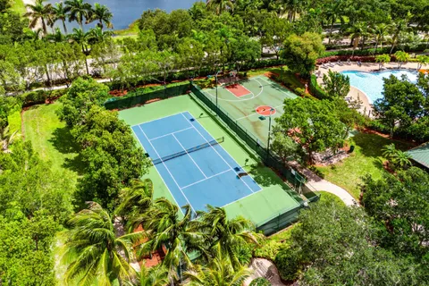 an aerial view of a house with yard swimming pool and outdoor seating