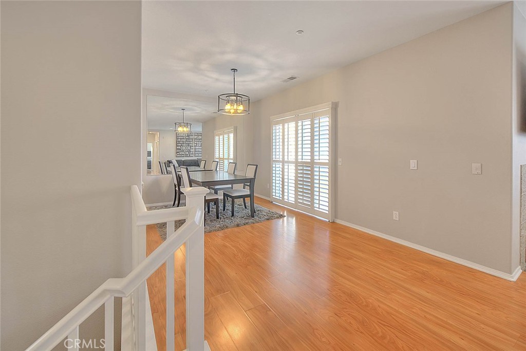 11450 Church Street, Unit 63 Rancho Cucamonga, CA 91730 - Photo 14 of 52 a view of a livingroom with furniture and wooden floor