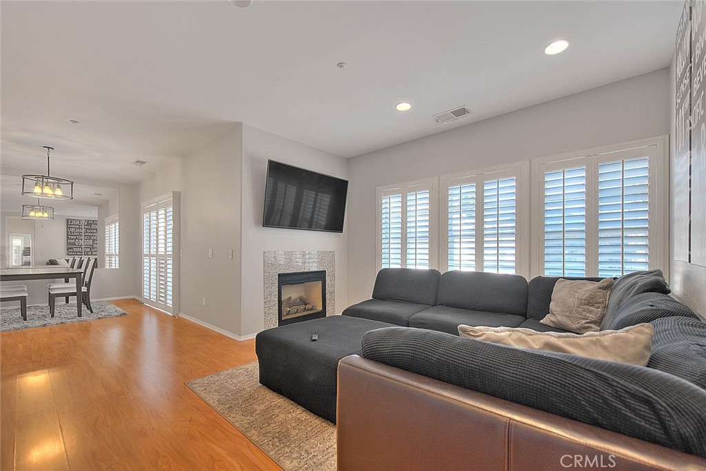 11450 Church Street, Unit 63 Rancho Cucamonga, CA 91730 - Photo 22 of 52 a living room with furniture and a fireplace