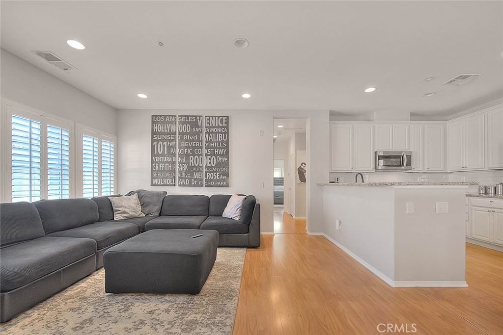 11450 Church Street, Unit 63 Rancho Cucamonga, CA 91730 - Photo 23 of 52 a living room with furniture and a large window