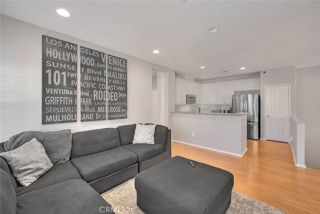 11450 Church Street, Unit 63 Rancho Cucamonga, CA 91730 - Photo 24 of 52 a living room with furniture and a large window