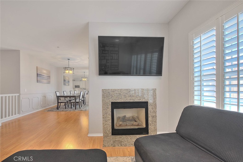 11450 Church Street, Unit 63 Rancho Cucamonga, CA 91730 - Photo 25 of 52 a living room with furniture and a fireplace