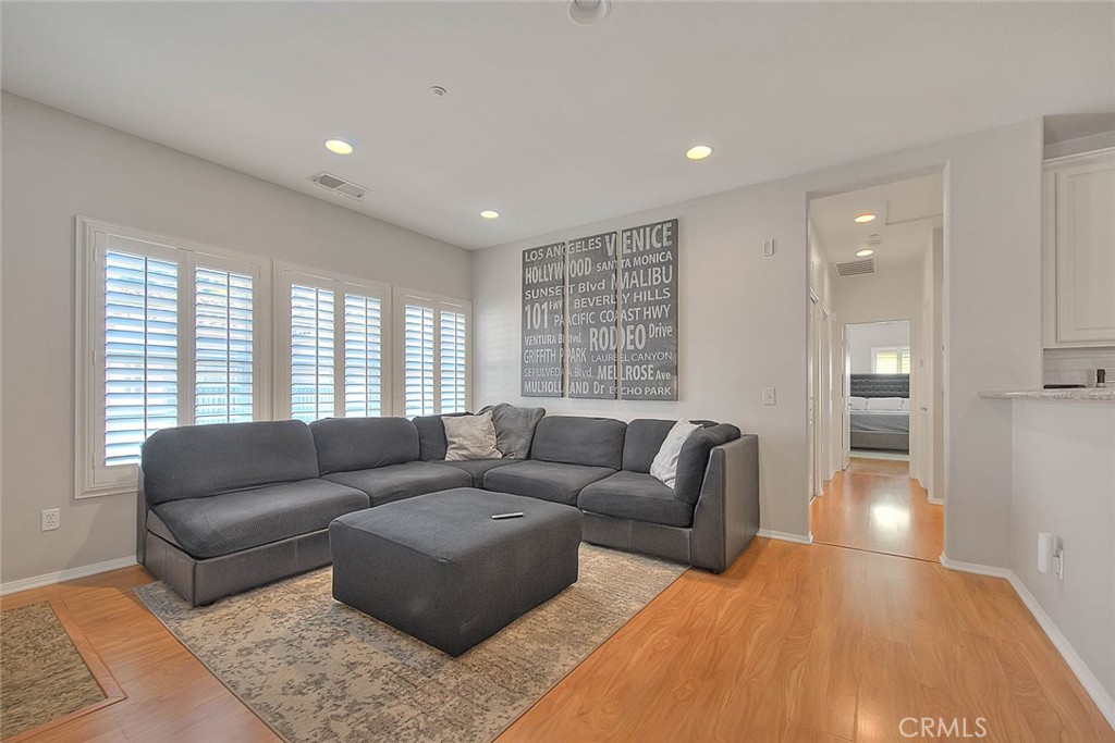 11450 Church Street, Unit 63 Rancho Cucamonga, CA 91730 - Photo 26 of 52 a living room with furniture and a large window
