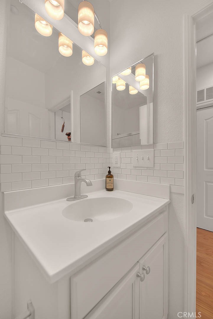 11450 Church Street, Unit 63 Rancho Cucamonga, CA 91730 - Photo 30 of 52 a bathroom with a sink and a mirror