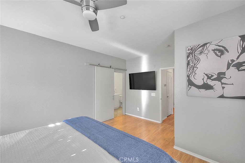 11450 Church Street, Unit 63 Rancho Cucamonga, CA 91730 - Photo 38 of 52 a bedroom with a bed and a television