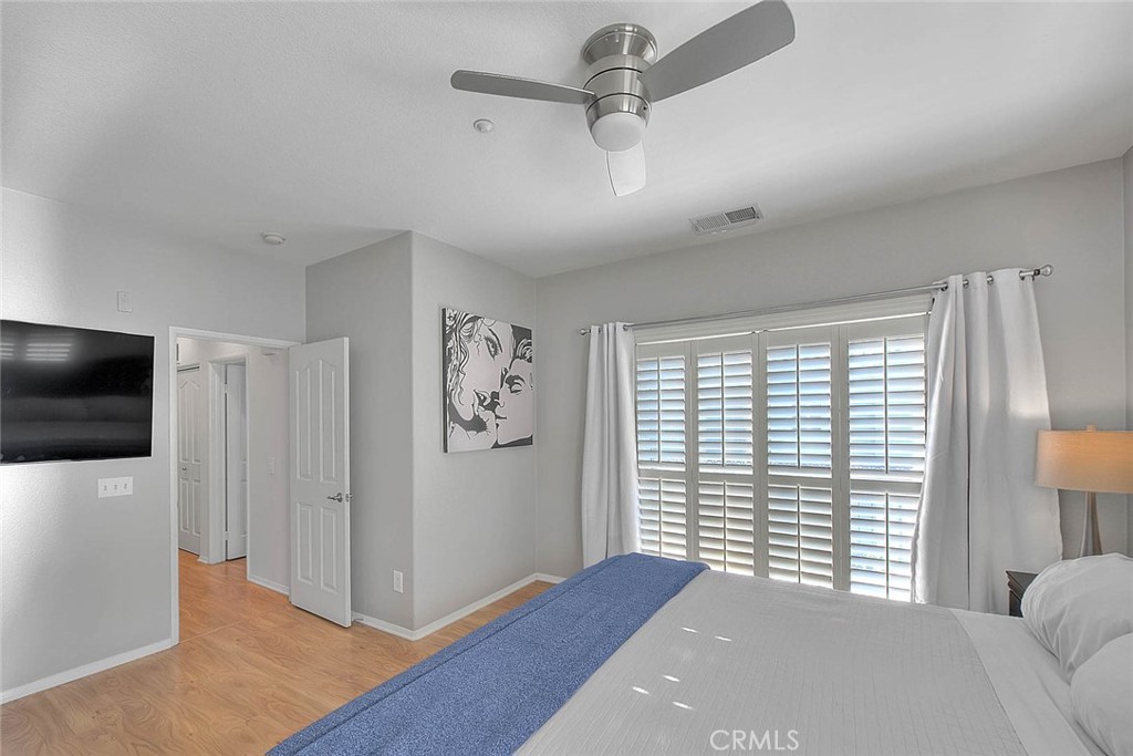 11450 Church Street, Unit 63 Rancho Cucamonga, CA 91730 - Photo 39 of 52 a bedroom with a large bed and a flat screen tv