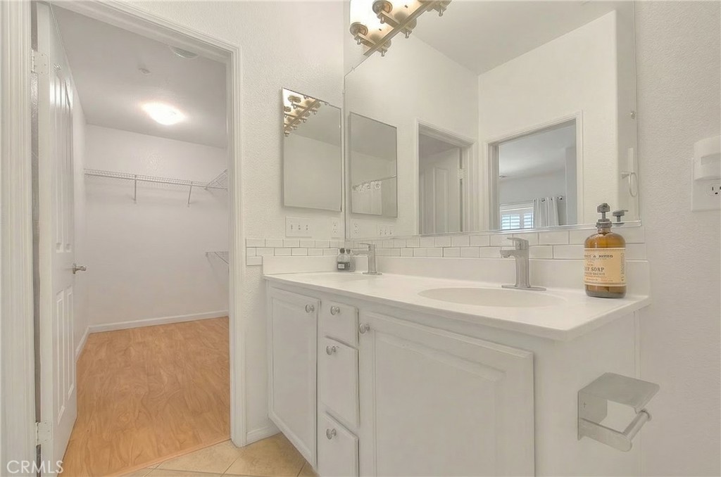 11450 Church Street, Unit 63 Rancho Cucamonga, CA 91730 - Photo 41 of 52 a bathroom with a sink double vanity and a mirror