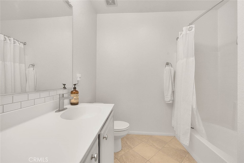 11450 Church Street, Unit 63 Rancho Cucamonga, CA 91730 - Photo 43 of 52 a bathroom with a sink a toilet and shower