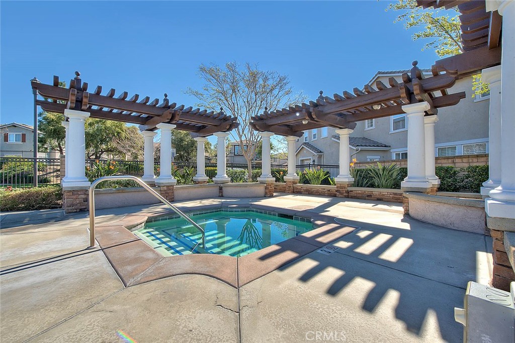 11450 Church Street, Unit 63 Rancho Cucamonga, CA 91730 - Photo 48 of 52 a view of a patio with couches table and chairs and potted plants