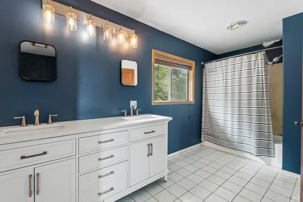 a bathroom with a sink toilet and mirror