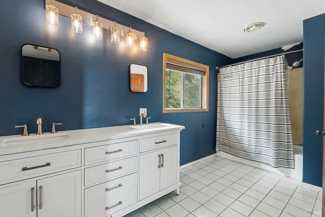a bathroom with a sink toilet and mirror