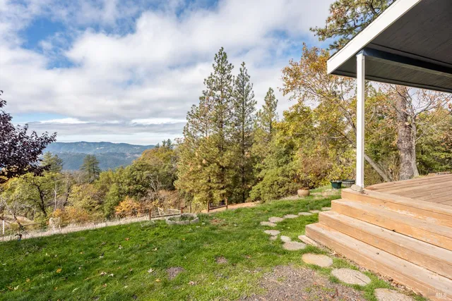 a view of a yard with an outdoor space