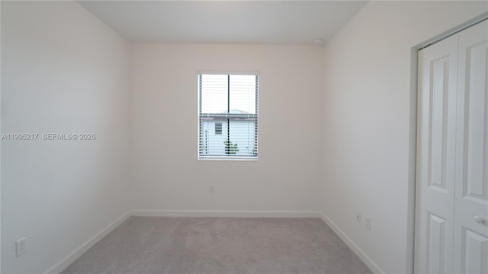 11870 Southwest 246th Street Homestead, FL 33032 - Photo 20 of 31 an empty room with a window