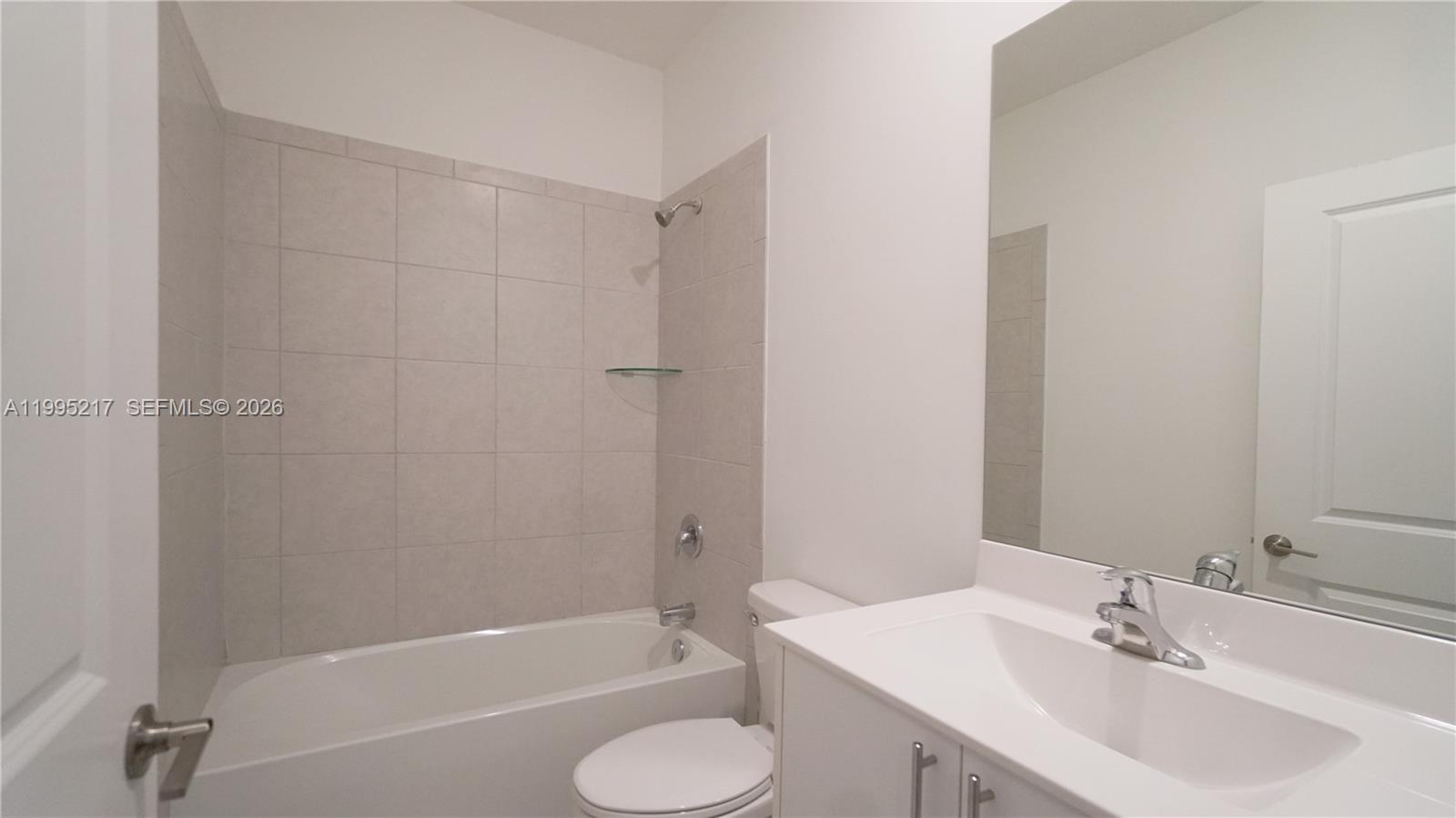 11870 Southwest 246th Street Homestead, FL 33032 - Photo 22 of 31 a bathroom with a sink toilet and bathtub
