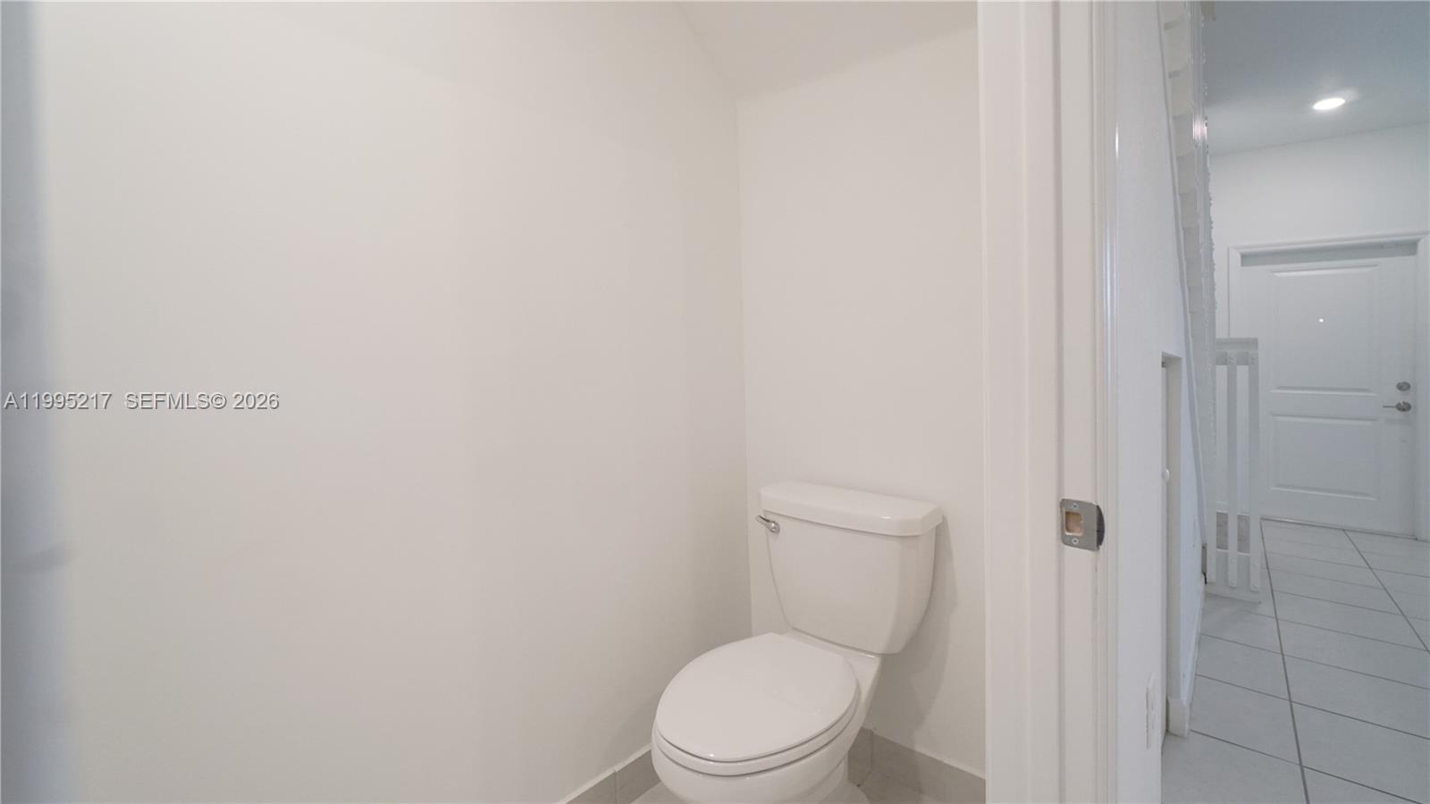 11870 Southwest 246th Street Homestead, FL 33032 - Photo 28 of 31 a white toilet sitting next to a shower