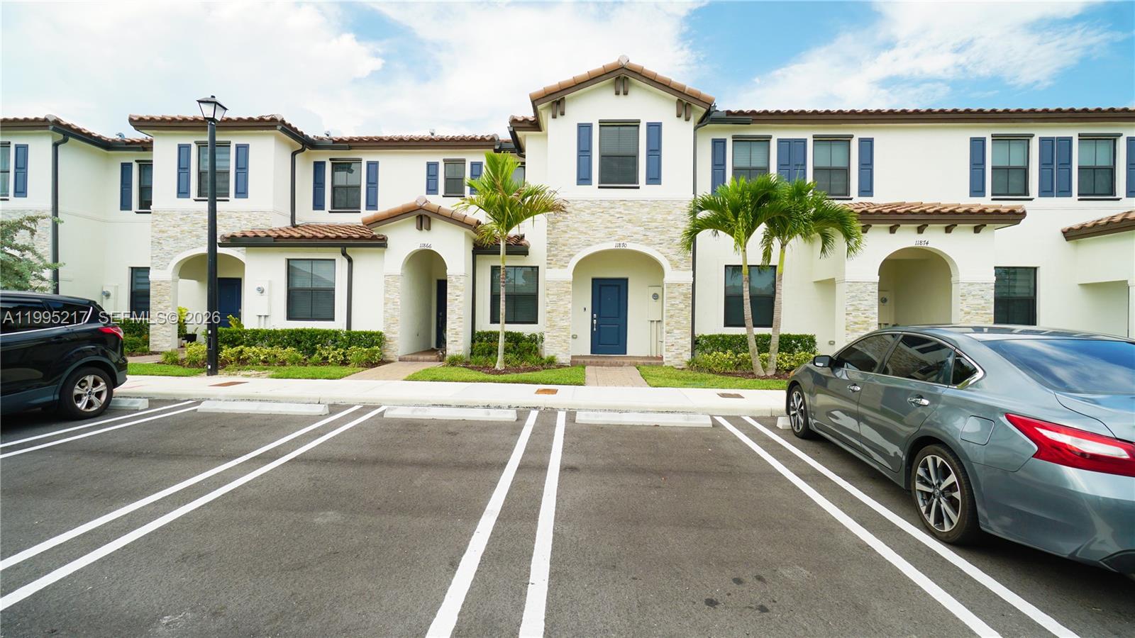 11870 Southwest 246th Street Homestead, FL 33032 - Photo 30 of 31 a view of a car parked in front of a house