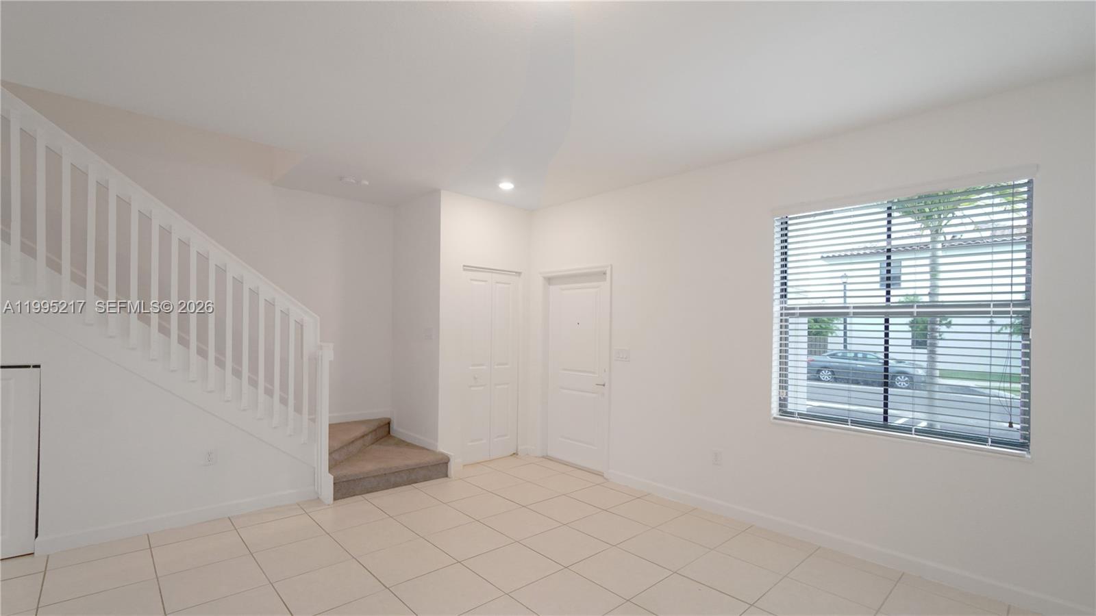 11870 Southwest 246th Street Homestead, FL 33032 - Photo 4 of 31 a view of an empty room with a window