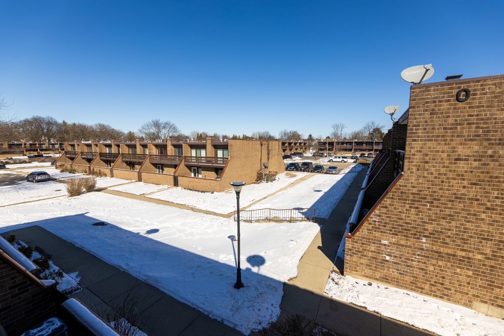 902 Kenneth Circle, Unit 6 Elgin, IL 60120 - Photo 20 of 24 a view of a terrace with chairs