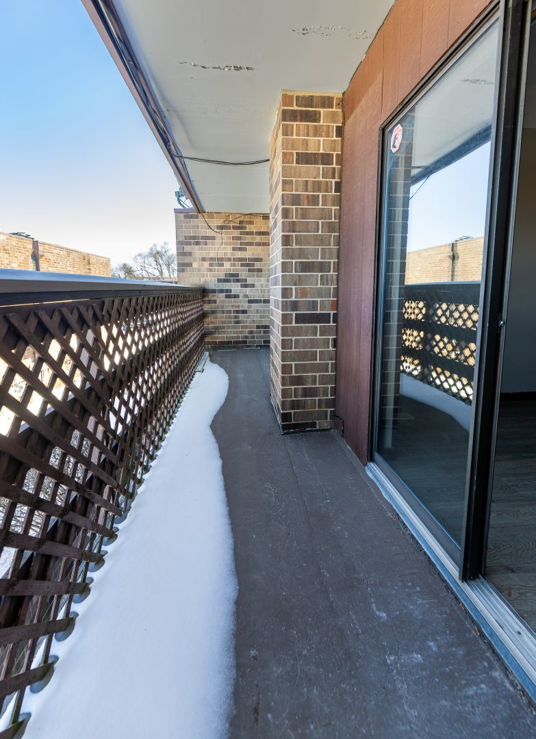 902 Kenneth Circle, Unit 6 Elgin, IL 60120 - Photo 24 of 24 a view of entryway with wooden floor