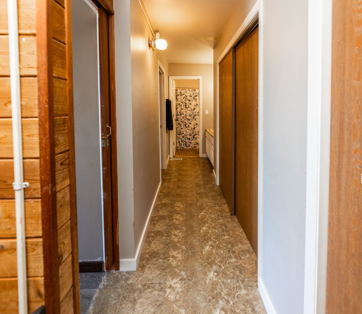 902 Kenneth Circle, Unit 6 Elgin, IL 60120 - Photo 7 of 24 a view of a hallway with a glass door
