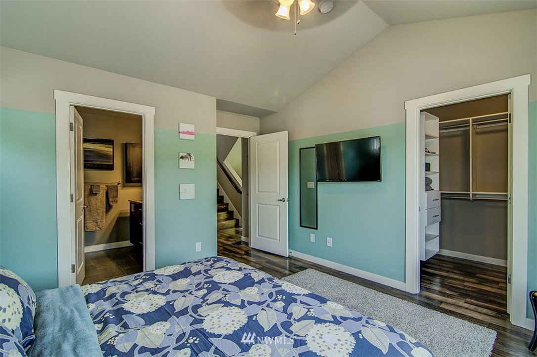 4417 Renton Avenue South Seattle, WA 98108 - Photo 13 of 21 a bedroom with a bed and a view of bathroom