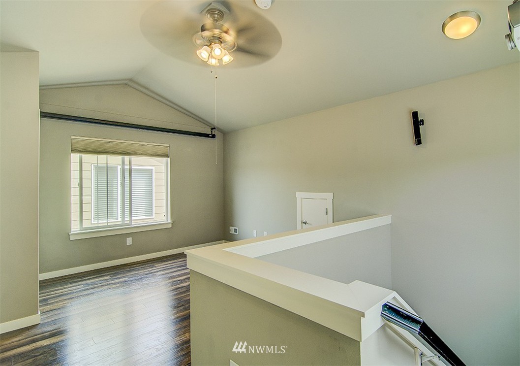 4417 Renton Avenue South Seattle, WA 98108 - Photo 19 of 21 a bedroom with a bed and a window