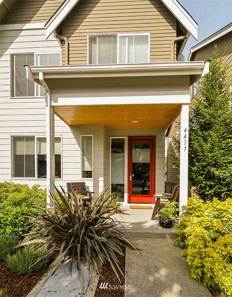 4417 Renton Avenue South Seattle, WA 98108 - Photo 21 of 21 a view of a house with potted plants and a table and chairs
