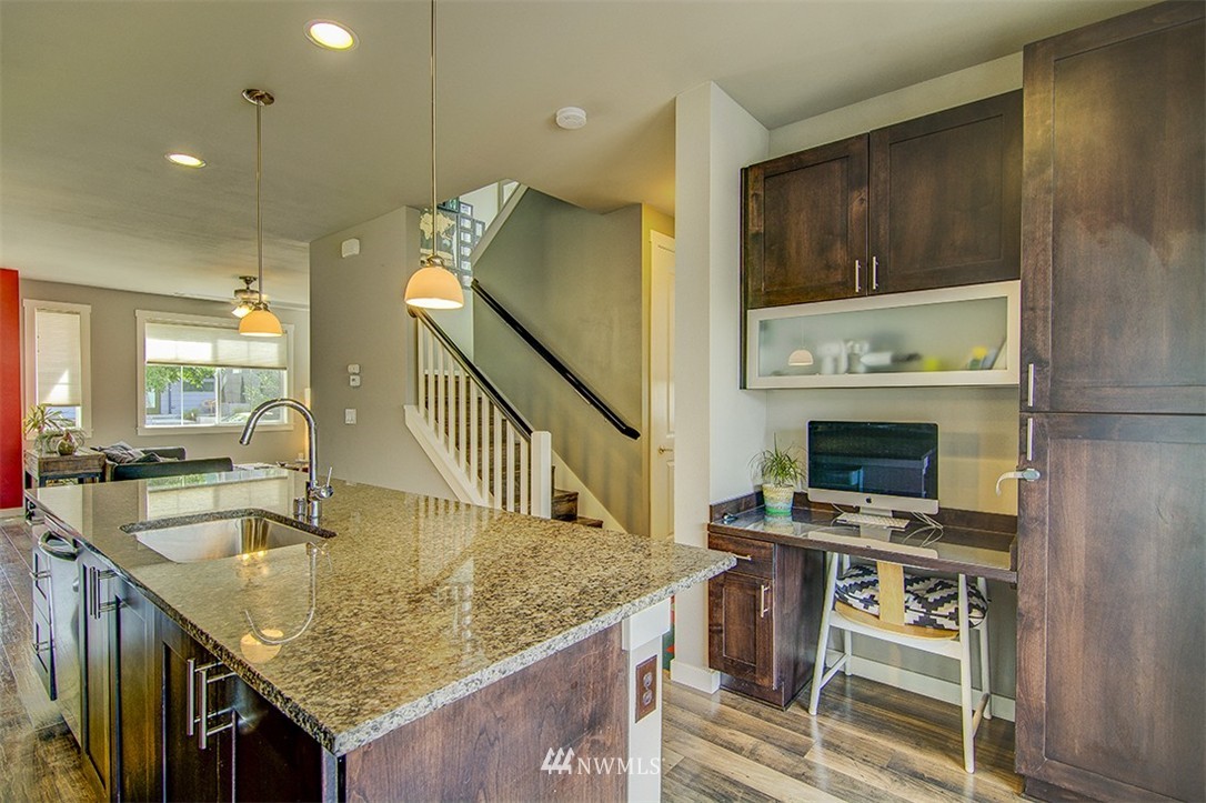 4417 Renton Avenue South Seattle, WA 98108 - Photo 7 of 21 a kitchen with a stove a sink and a refrigerator