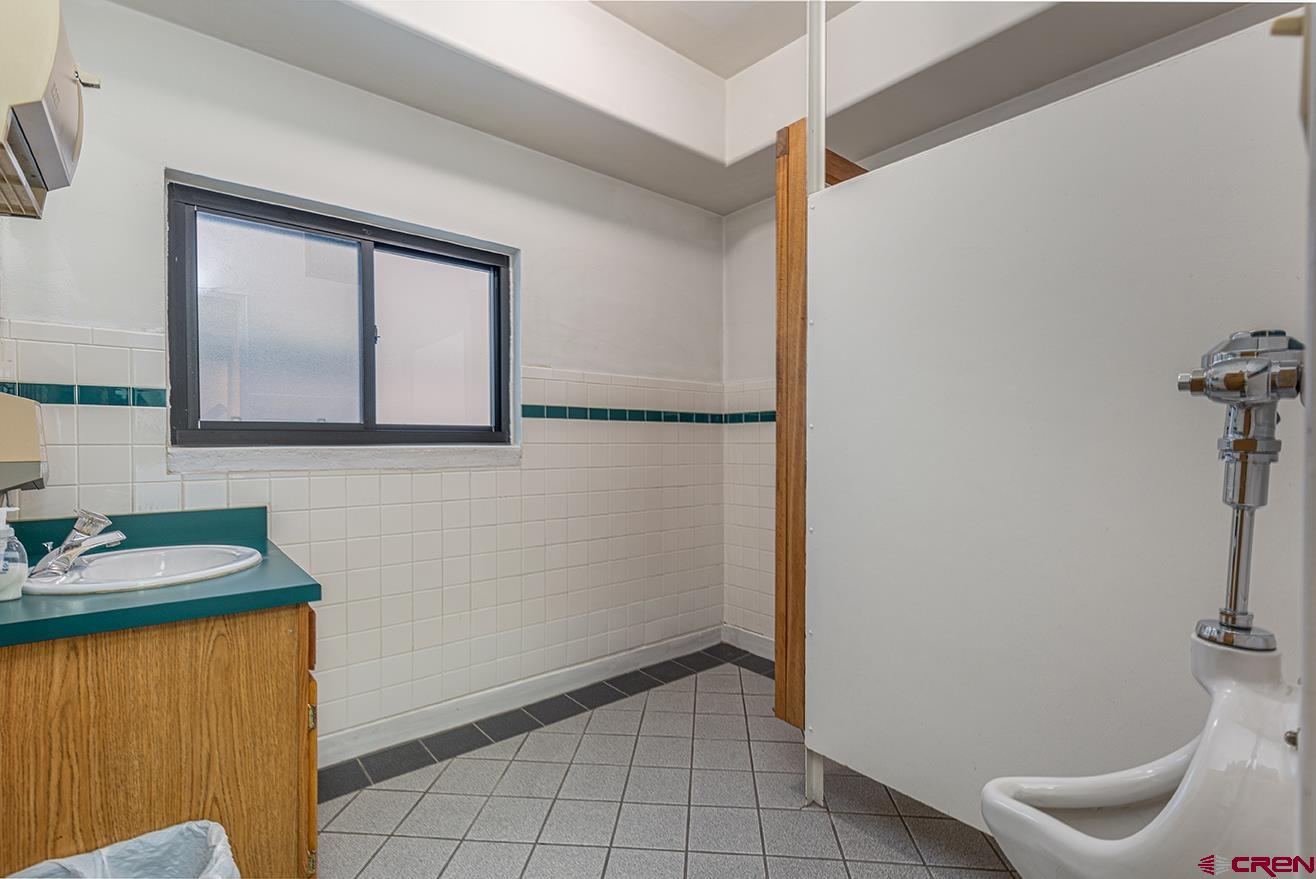 1211 Main Avenue Durango, CO 81301 - Photo 10 of 12 a view of a room that has a sink and a mirror in it