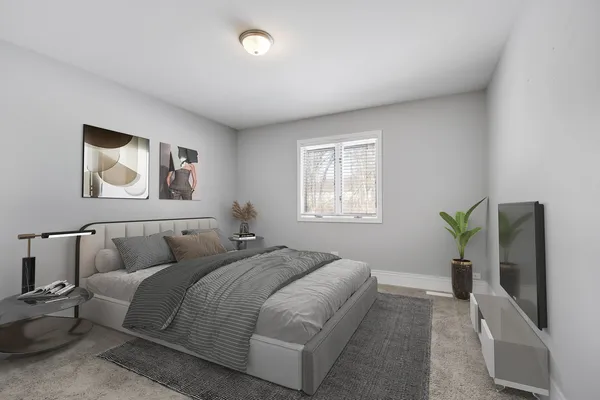 a bedroom with a bed and a couch