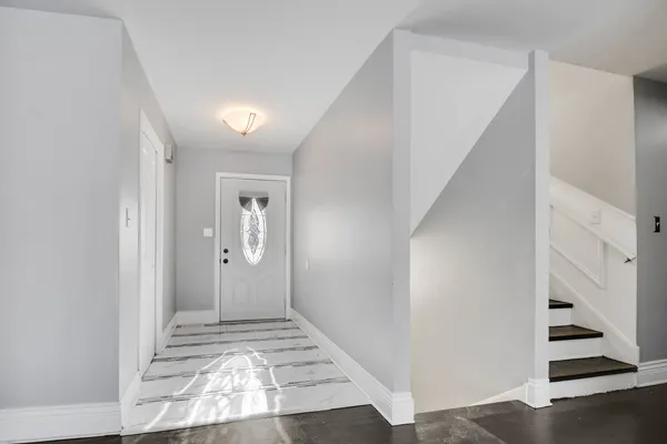 a view of a hallway view with staircase