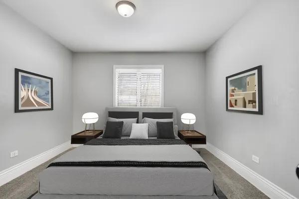 a bedroom with a bed and window