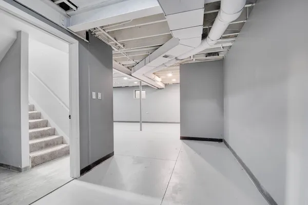 a view of a hallway with stairs