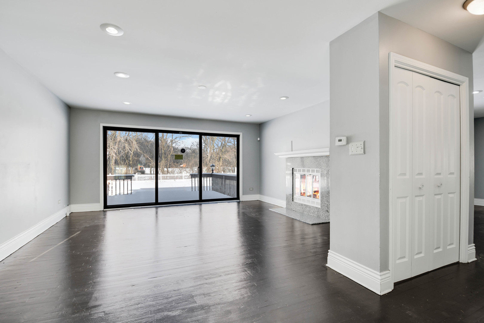 249 Milburn Avenue Crete, IL 60417 - Photo 4 of 46 a view of an empty room with wooden floor and a window