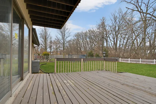 a view of a deck with wooden floor and outdoor space