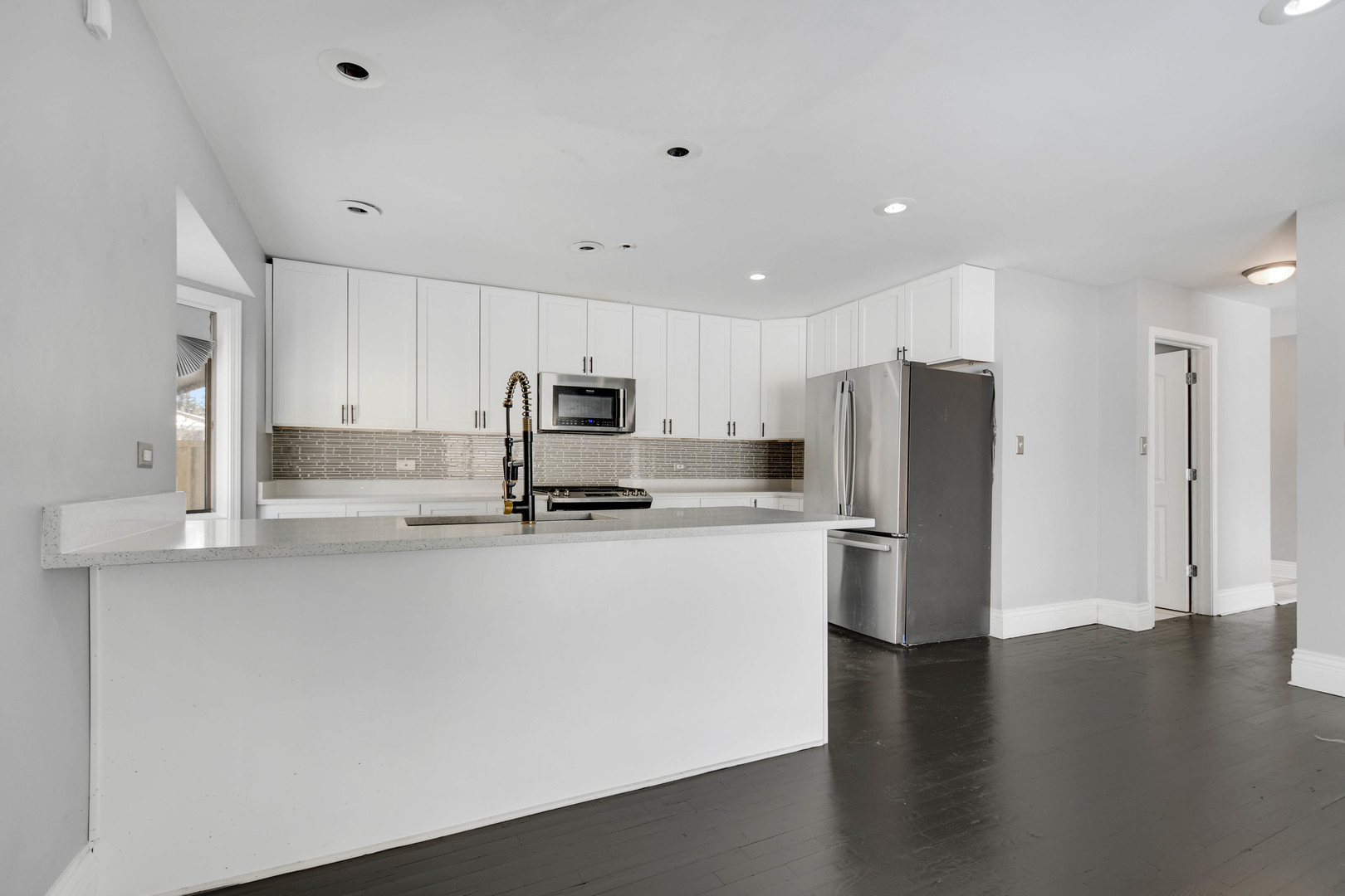 249 Milburn Avenue Crete, IL 60417 - Photo 9 of 46 a kitchen with stainless steel appliances a refrigerator sink and microwave