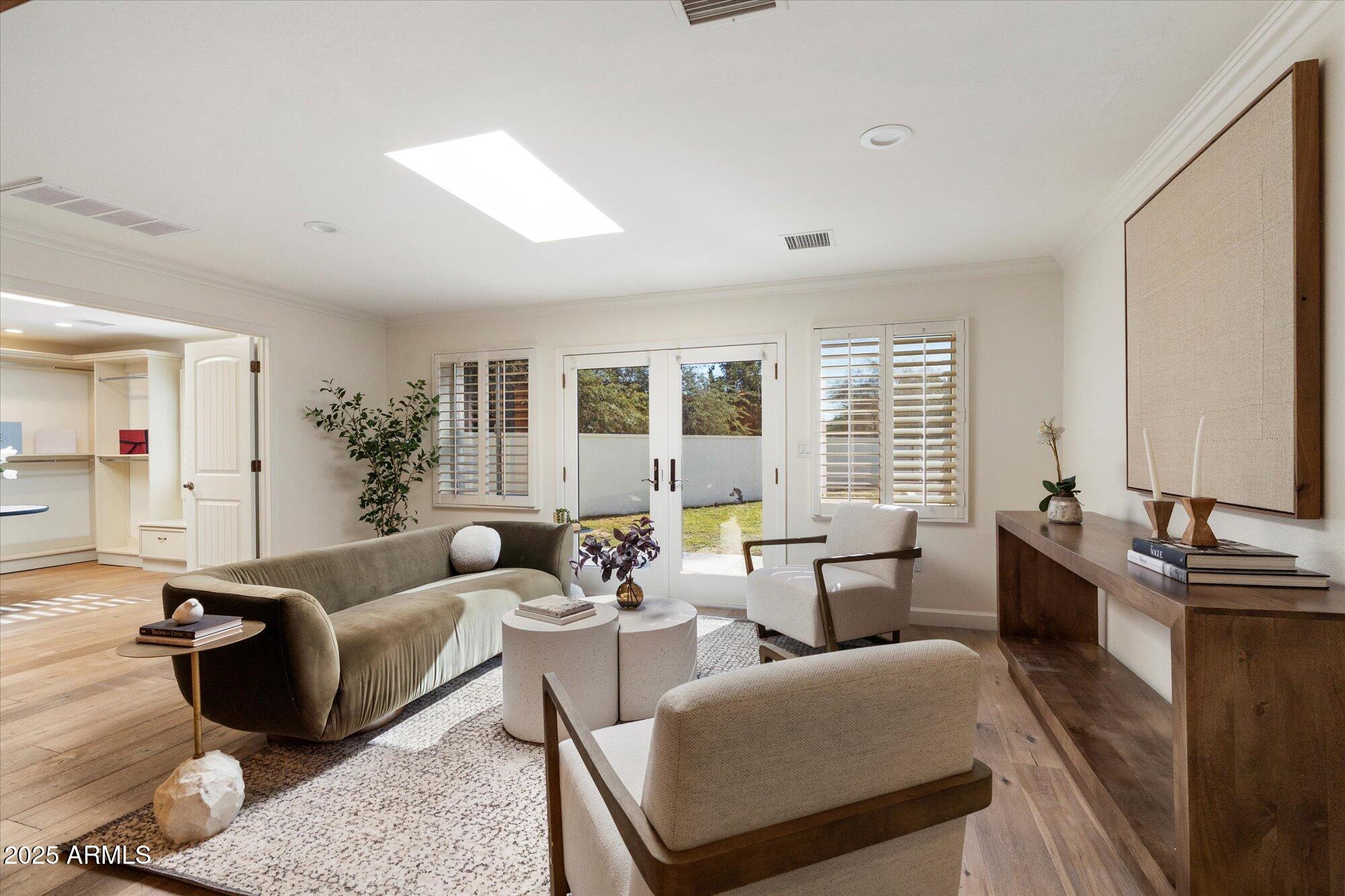 6533 East Maverick Road Paradise Valley, AZ 85253 - Photo 12 of 20 a living room with furniture potted plant and a large window