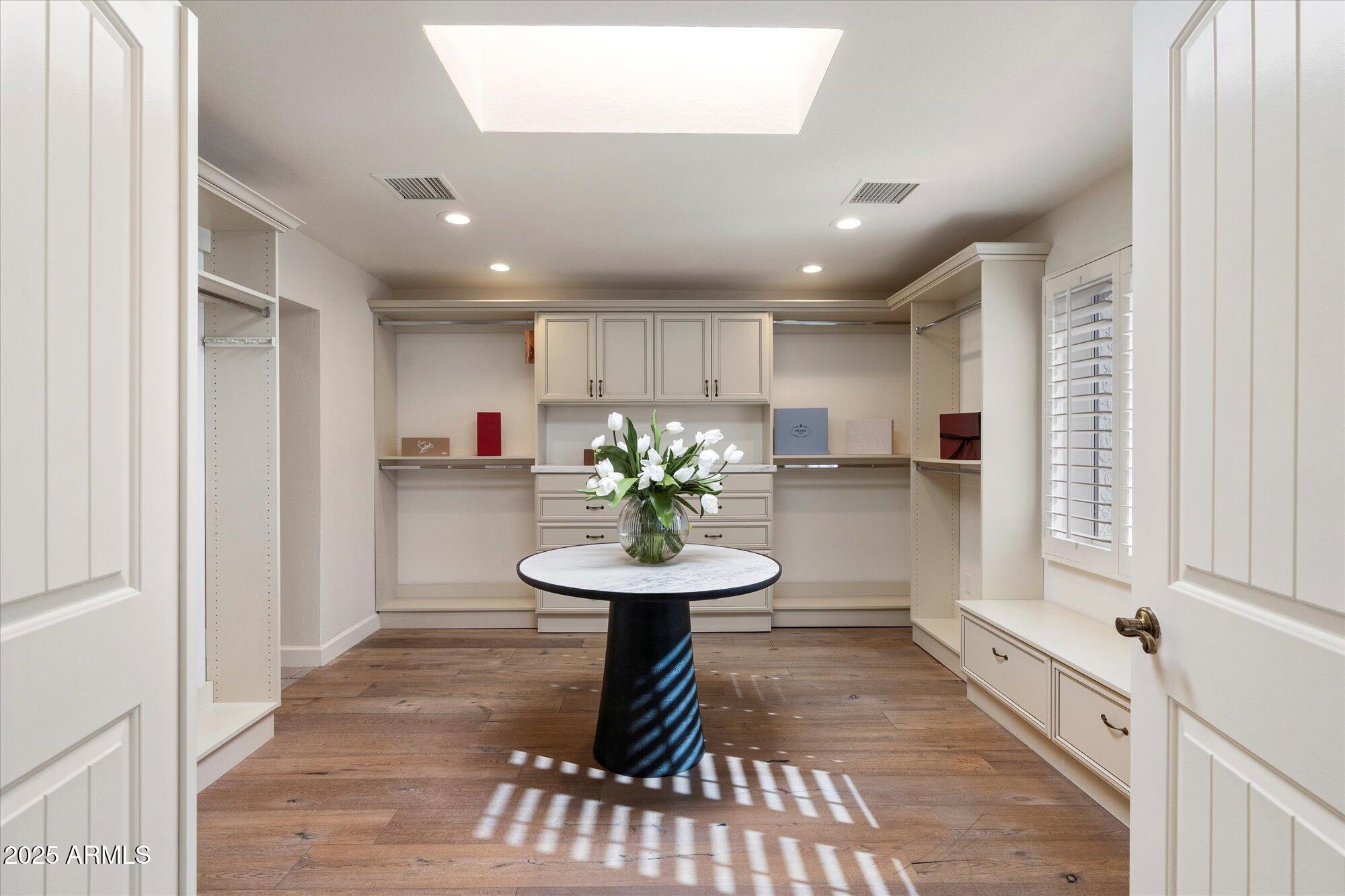 6533 East Maverick Road Paradise Valley, AZ 85253 - Photo 13 of 20 a view of a hallway with furniture and a potted plant